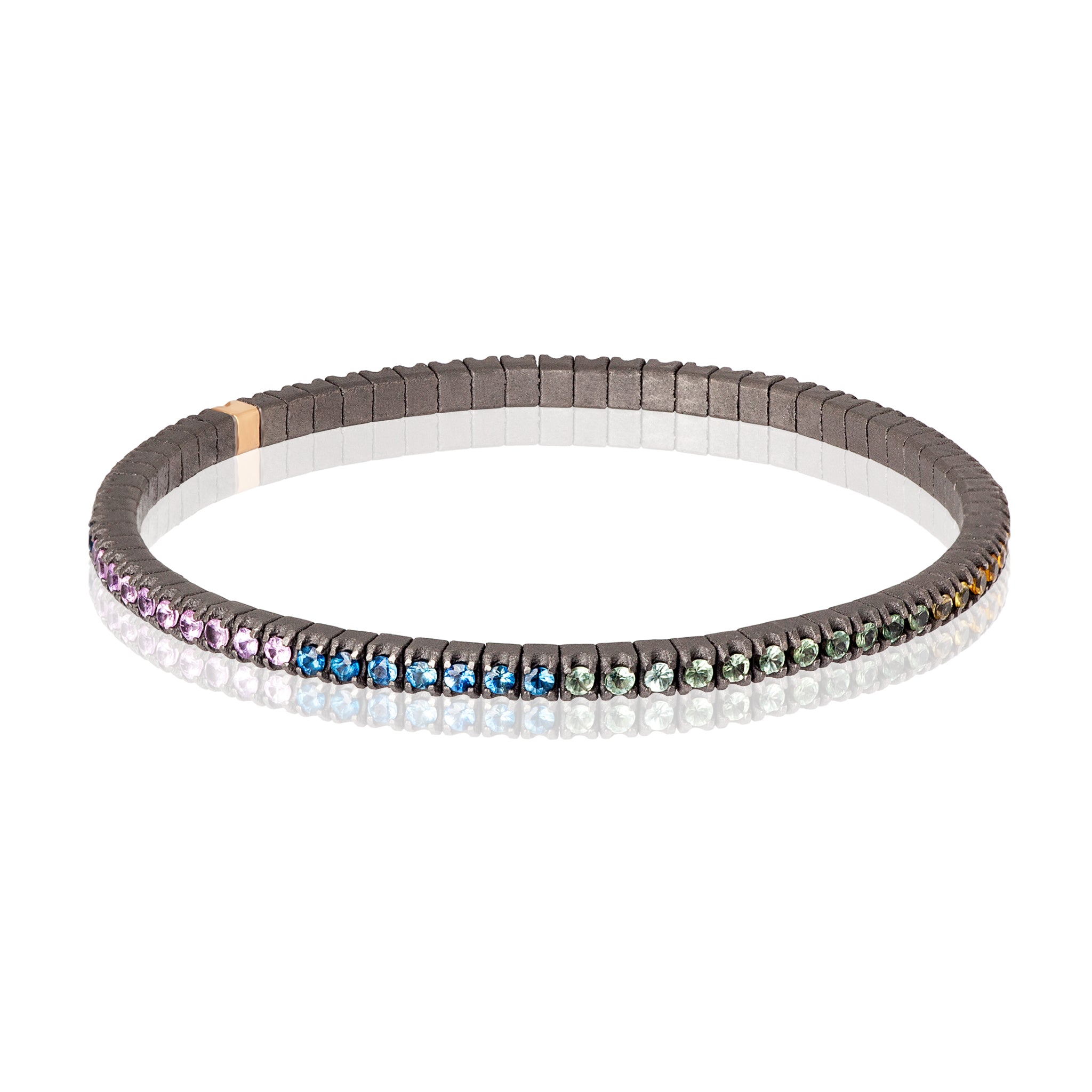 BRACCIALE TENNIS LINEA ELASTICA IN TITANIO, ORO ROSSO 18 KT E ZAFFIRI MULTICOLOR DA 3 PUNTI.