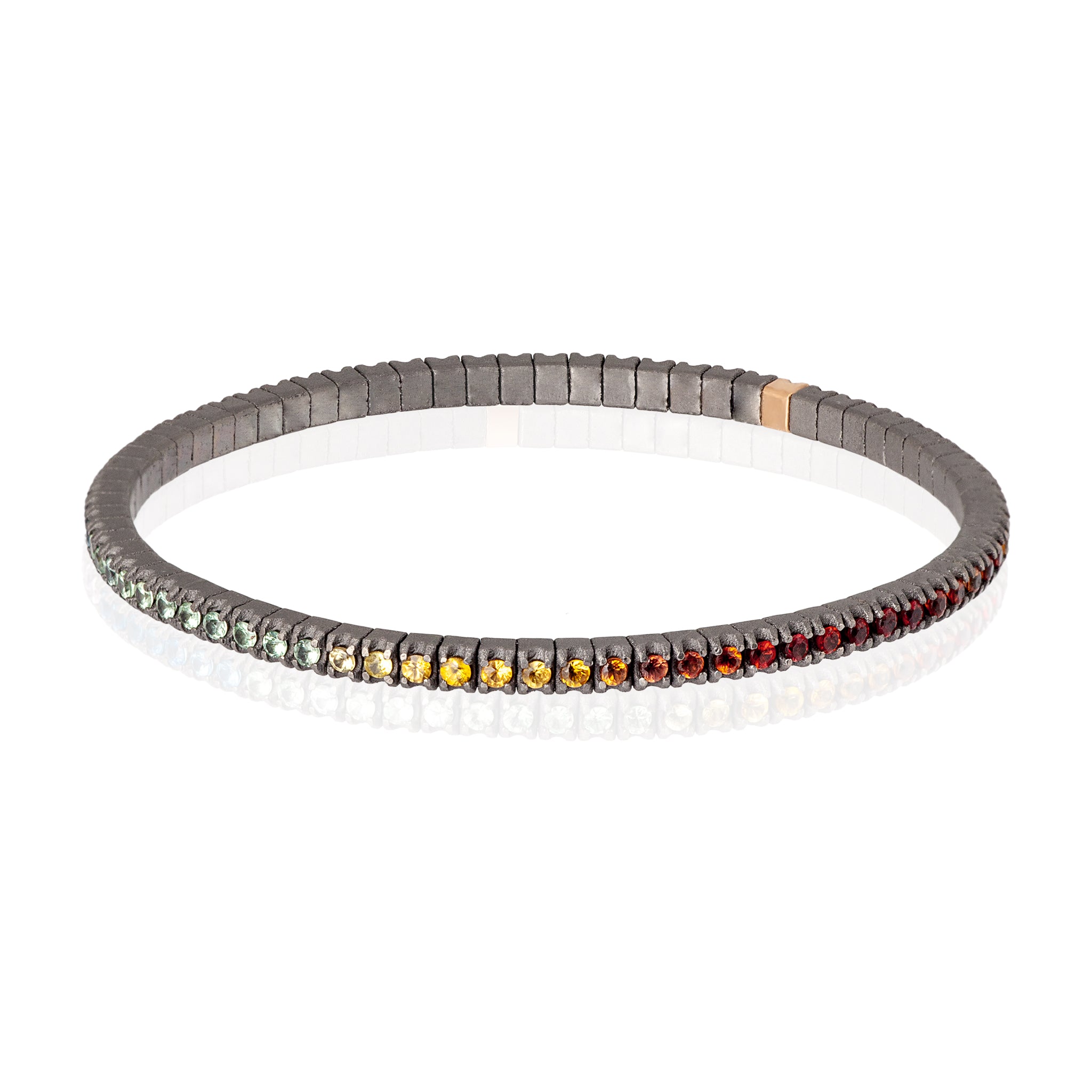 BRACCIALE TENNIS LINEA ELASTICA IN TITANIO, ORO ROSSO 18 KT E ZAFFIRI MULTICOLOR DA 3 PUNTI.